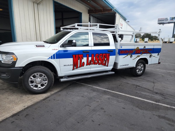 Scenic view of a highway leading towards mountains, evoking the Mt. Lassen area